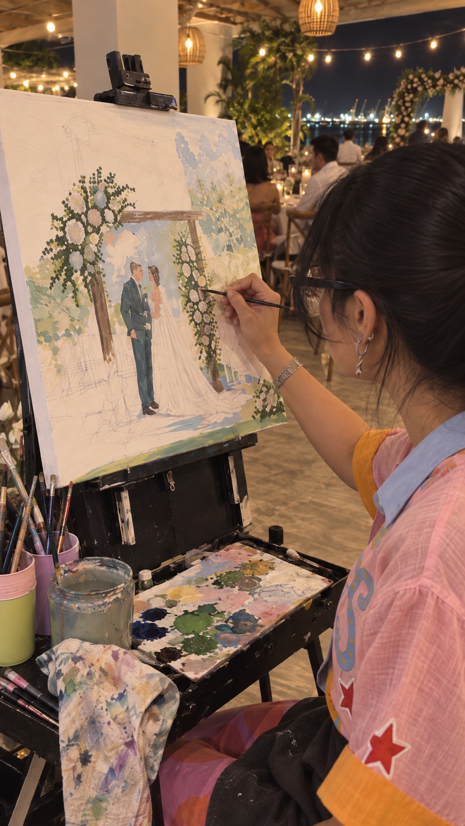 Proceso de una pintura en vivo de una pareja durante su boda